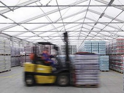 Interior view of a RÖDER warehouse with forklift truck and pallets